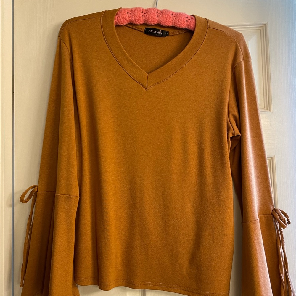 V-neck top, bows on top of flared sleeves, thick cotton/poly, size medium.